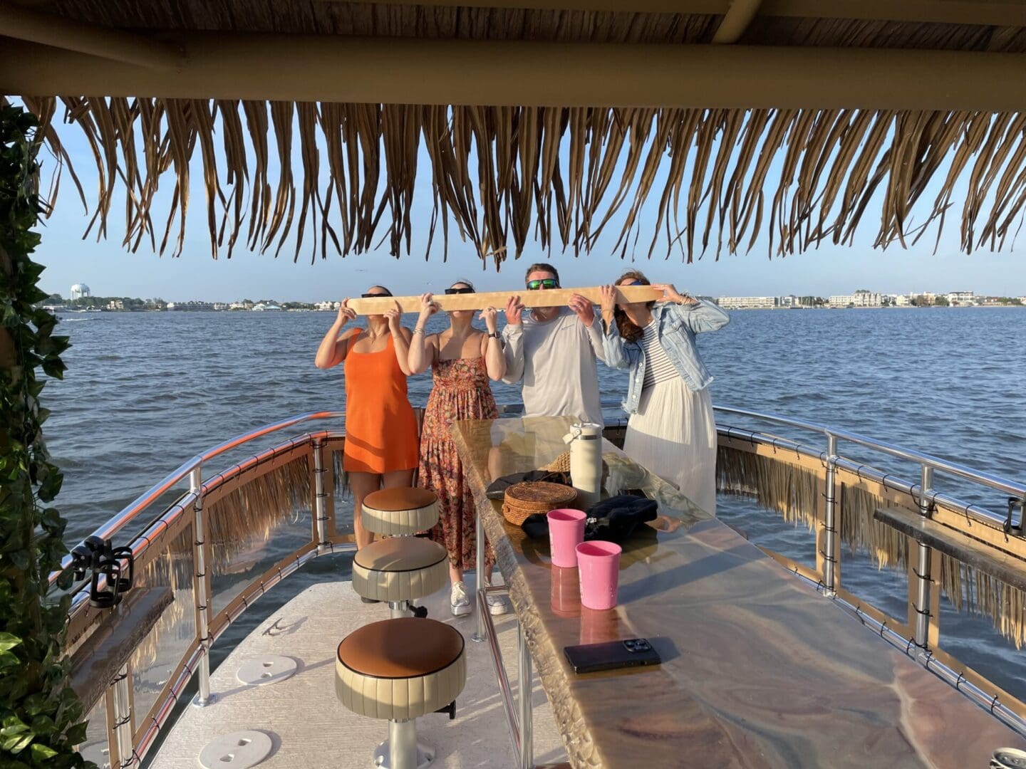 A group of people sitting at tables on a boat